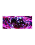 Mouse pad featuring Tanjiro Kamado in action, 28x12 inches, with vibrant reds and purples capturing his intense fiery attack.