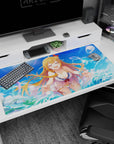 40x20 inches anime girl desk pad showing a laughing blonde with flower ribbon clip by splashy waves.