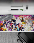 Candy pink concert vibes anime girl desk pad with confetti ribbons and stage lights, 36x16 inches.