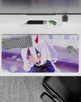 32x16 inches mouse pad with chibi Zero Two design, featuring soft white hair, glowing eyes, and delicate horns amidst a dreamy snowy backdrop for winter magic.