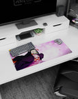 Mouse pad featuring Nezuko from Demon Slayer, size 28x12 inches, showing her amidst pink sakura petals, vibrant and dynamic.