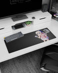 Anime girl holding a tiny camera on extended mouse pad 32x12 inches, big blue ribbon and pouty look.