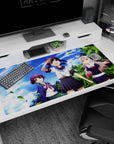 40x20 inches anime desk pad showing three cute heroines posing beneath bright clouds and swaying palms.