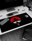 40x20 inches Naruto desk pad featuring Itachi Uchiha perched in a calm crow pose beneath a red moon.