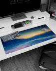 Calming 36x16 anime desk mat with snow-capped peaks and a glowing sky, capturing the beauty of morning light for a tranquil workspace