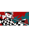 36x16 inch desk pad highlighting Tanjiro Kamado's intense expression with bold red and teal art