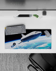 Moody black-sky 28x12 inches desk mouse pad with calm horizon glow, airy blues, and soft cloud swirls.