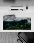 28x12 inches mouse pad with misty forest design, blending green hills and fog for a tranquil nature-inspired desk.