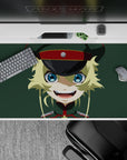 Cute chaotic vibe desk pad 40x20 inches in flat colors: blue eyes, yellow hair, dark cap, muted green.