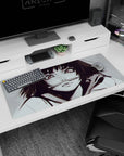 36x16 inches desk pad showing a mischievous anime girl in a hoodie, pen in her mouth, close-up gaze.