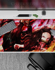 Dynamic 40x20 inch anime desk pad showcasing the fiery determination of Tanjiro and Nezuko in battle