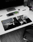 Anime girl reaches out over a cityscape on mouse pad 32x16 inches, flowing sleeves and short skirt.