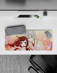 28x12 inches anime mouse pad in warm peach and blush pink, calm romantic vibe with drifting sakura.