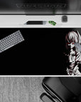 Dark black anime desk pad 40x20 inches with moody white line art and edgy hypnotic vibes.
