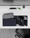 28x12 inches monochrome anime girl desk mat in moody gray tones with sharp ink-streak hair highlights.