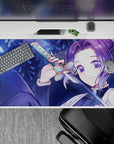 40x20 inches desk pad showcasing Shinobu Kocho surrounded by glowing blue butterflies, reflecting her serene and deadly nature.