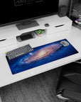 Mesmerizing space vortex scene mouse pad, 32x12 inches, featuring a swirling galaxy with scattered stars.