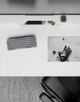 14x10 inches classic anime mouse pad in soft gray steel tones, quiet melancholy vibe, drifting pixels.