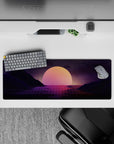 Intense 32x12 desk mat features glowing grid and serene sunset with intricate mountain silhouettes for fans
