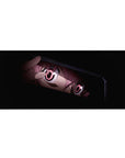 Anime girl desk pad 36x16 inches with tight close-up art, glossy pink eyes, and dark moody framing.