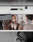 Warm hallway glow anime desk pad 36x16 inches in chestnut, white, and orange with bold blue-eyed gaze.