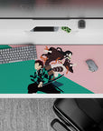 Sleek 36x16 inch desk pad featuring iconic forms of Tanjiro and Nezuko for fans of Demon Slayer