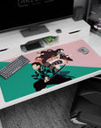 Premium 40x20 inch desk pad with artistic depiction of Tanjiro and Nezuko, perfect for anime enthusiasts
