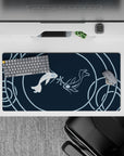 Dynamic 32x16 desk mat combines koi fish and circular waves for impactful yet soothing visuals