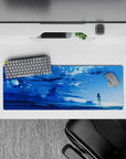32x12 inches anime mouse pad in icy blues with drifting clouds, sparkles, and calm reflective water.