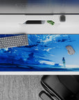 36x16 inches anime desk pad in icy blue tones with drifting clouds, calm coastal mood, and soft sparkles.