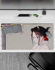 32x16 inches pastel desk mat in warm gray and lilac petals, calm spring vibe with soft anime art.