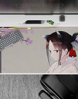 Cozy 40x20 inches anime desk pad in warm gray with lilac petals, soft spring vibes and calm gaze.
