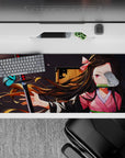 Sleek 36x16 inch desk pad featuring Nezuko's tranquil beauty and inner power for anime enthusiasts