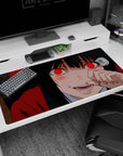 40x20 inches Yumeko Jabami desk pad, sly half-smile and blushing cheeks, fingers near lips in red hoodie.