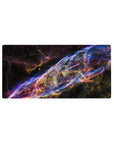 Cosmic ribbon galaxy desk mouse pad 32x16 inches with neon swirls and star-speckled space backdrop.