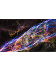 Cosmic ribbon galaxy desk pad with star-speckled deep space backdrop, 40x20 inches.
