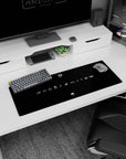 Uchiha clan fan emblem beneath Hidden Leaf swirl, clean Naruto desk mat scene, 32x12 inches.