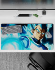 32x16 inches mouse pad showcasing Vegeta in Super Saiyan Blue, surrounded by a vibrant blue aura and focused on his powerful attack.