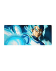 Mouse pad featuring Vegeta in Super Saiyan Blue, 28x12 inches, surrounded by his blue aura as he prepares for a powerful attack.