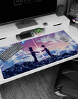40x20 inches anime desk pad of hooded teens facing on a cloud ridge, reaching as light snaps between.