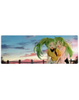 Anime girl mouse pad 32x12 inches with two green-haired besties, ponytails, playful wink at sunset.