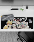 Compact 32x12 inch mouse pad highlighting Tanjiro, Nezuko, Zenitsu, Inosuke, and Giyu for anime fans