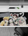 Sleek 36x16 inch desk pad featuring Tanjiro, Nezuko, Zenitsu, Inosuke, and Giyu for fans of camaraderie