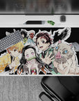 Dynamic 40x20 inch anime desk pad showcasing the iconic Demon Slayer team's camaraderie and adventure