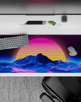 36x16 inches desk pad with Retro Sunset Peaks, showcasing a vibrant sunset and neon waves with blue mountain contours for a surreal design.
