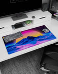Modern 32x16 inches mouse pad featuring Retro Sunset Peaks, showcasing neon waves and a surreal sunset behind blue glowing mountains.