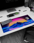 Artistic 36x16 inches desk pad featuring Retro Sunset Peaks, blending a radiant sunset and neon contours in a retro-inspired, surreal landscape.