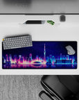 Intense 32x12 desk mat features neon skyline and water reflections with intricate glowing details for fans
