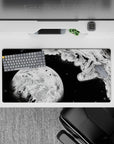 32x16 inches black and white anime mouse pad, bold contrast, ink splashes, quiet brave deep-space mood.