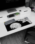 28x12 inches anime mouse pad showing a caped hero diving past shattered rock toward a cold, glowing planet.
